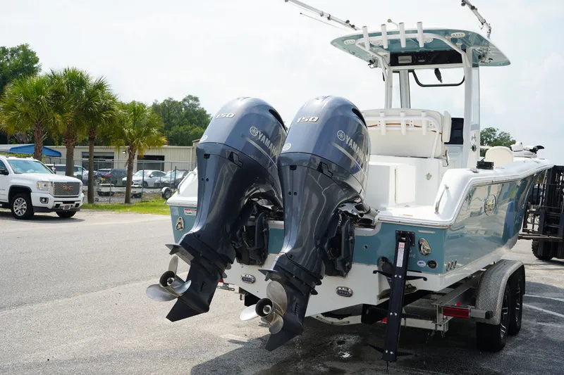 Slide: The Image of 2022 Sea Hunt Gamefish 25 boat with dual Yamaha 150 engines on a trailer. - 3