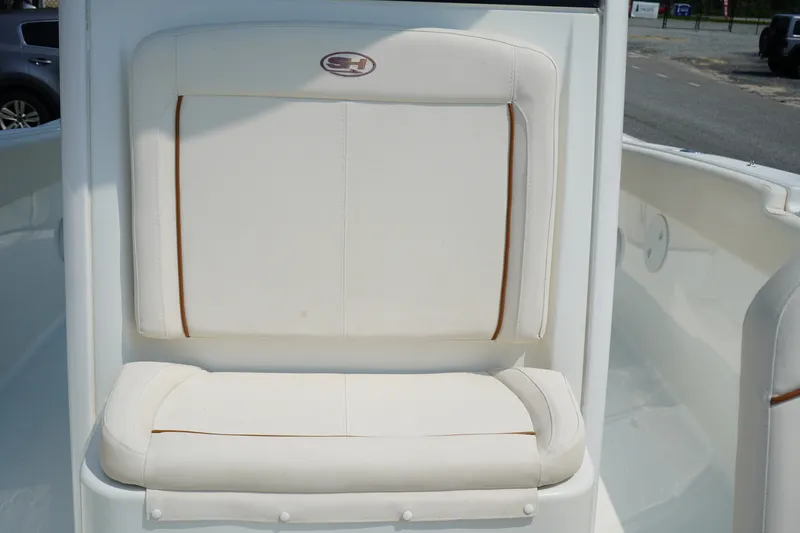 Slide: The Image of 2022 Sea Hunt Gamefish 25 boat seat with white upholstery and logo. - 6