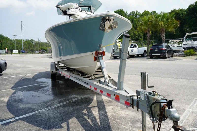 Slide: The Image of 2022 Sea Hunt Gamefish 25 boat on trailer in parking lot. - 21