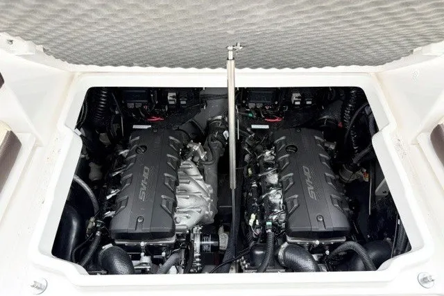 Slide: The Image of 2024 Yamaha Boats 255 FSH Sport H engine compartment with dual engines. - 19