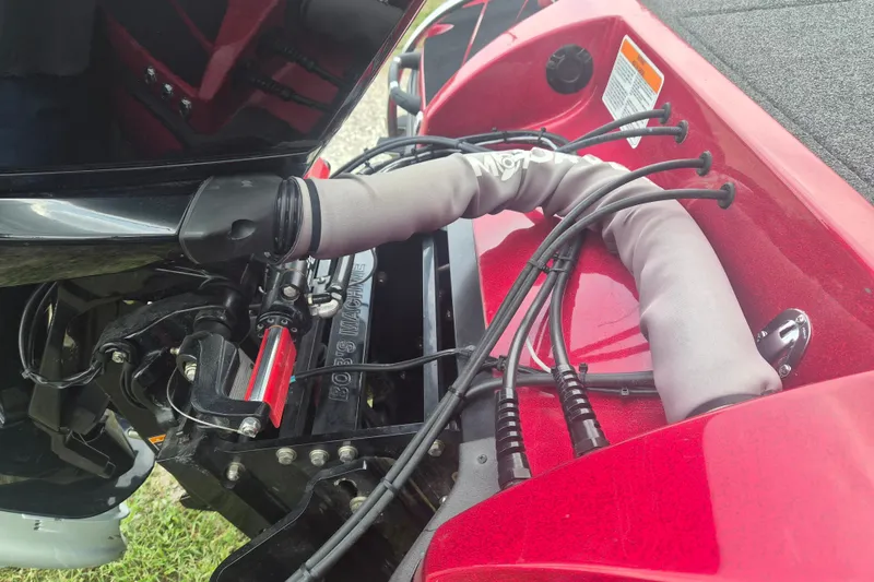 Slide: The Image of Close-up of a 2021 Nitro Z20 boat engine compartment with cables and protective covers. - 6