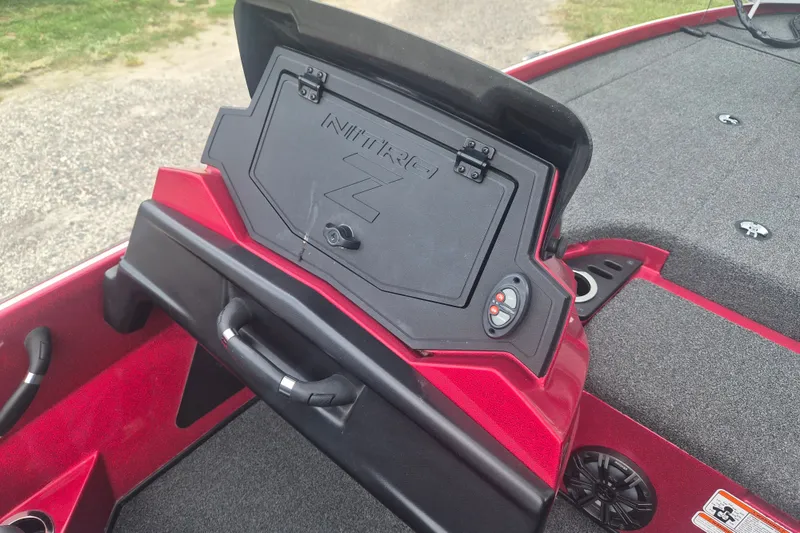 Slide: The Image of Red 2021 Nitro Z20 boat dashboard with storage compartment and control panel. - 14