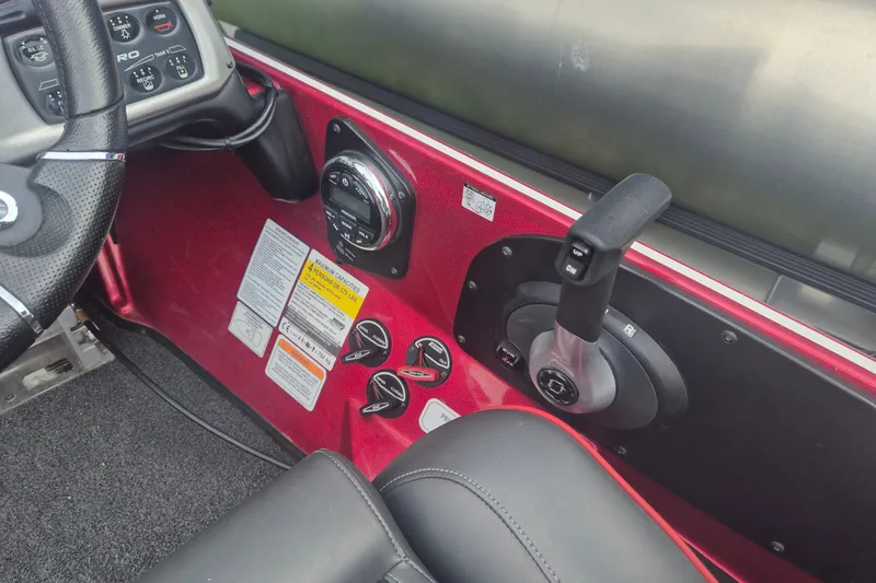 Slide: The Image of Control panel of a 2021 Nitro Z20 boat with steering wheel and throttle. - 17