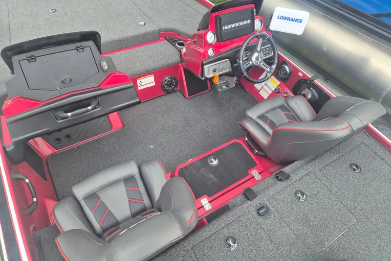 Slide: The Image of 2021 Nitro Z20 boat interior with steering console, seats, and storage compartments. - 10
