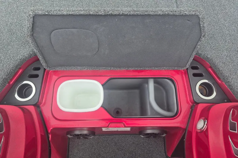 Slide: The Image of 2021 Nitro Z20 boat storage compartment with cup holders and carpeted interior. - 21