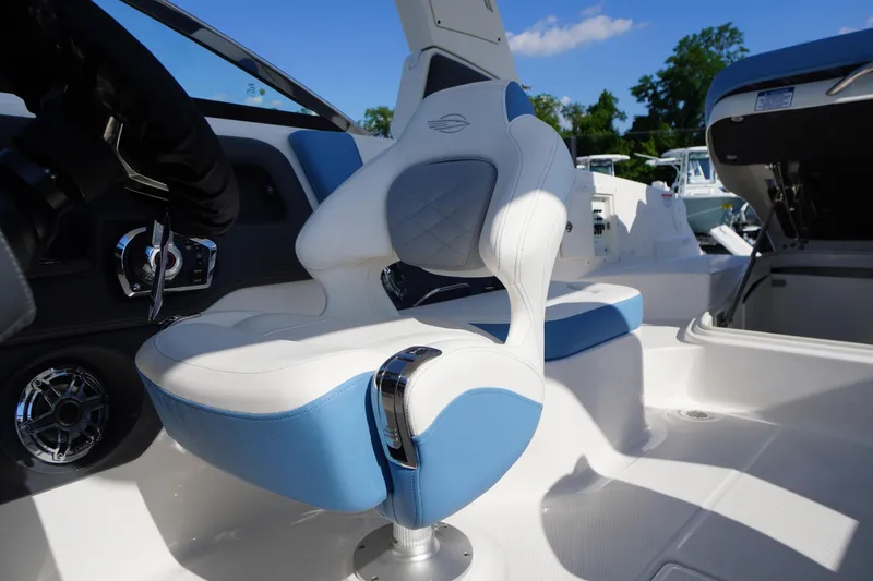 Slide: The Image of Luxury seating in the 2026 Chaparral 270 OSX boat, featuring blue and white upholstery. - 49