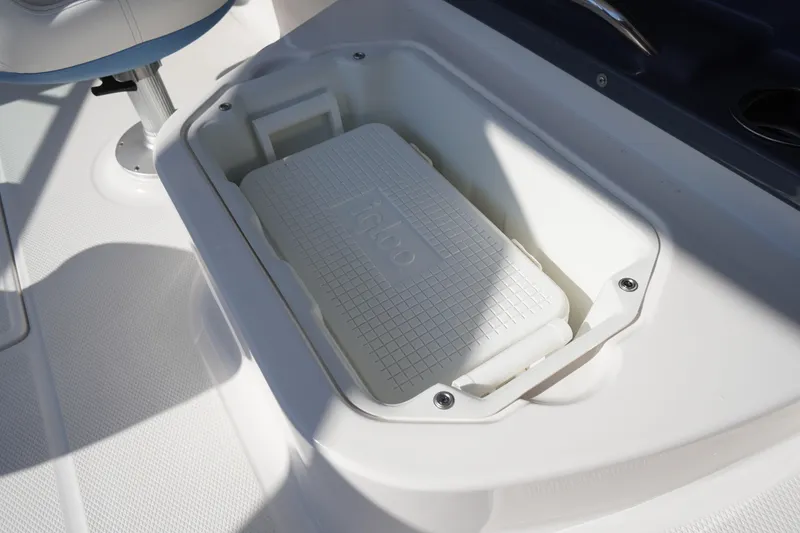 Slide: The Image of Built-in cooler compartment on 2026 Chaparral 270 OSX boat deck. - 53