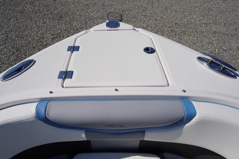 Slide: The Image of Bow view of 2026 Chaparral 270 OSX boat with sleek white and blue design. - 20