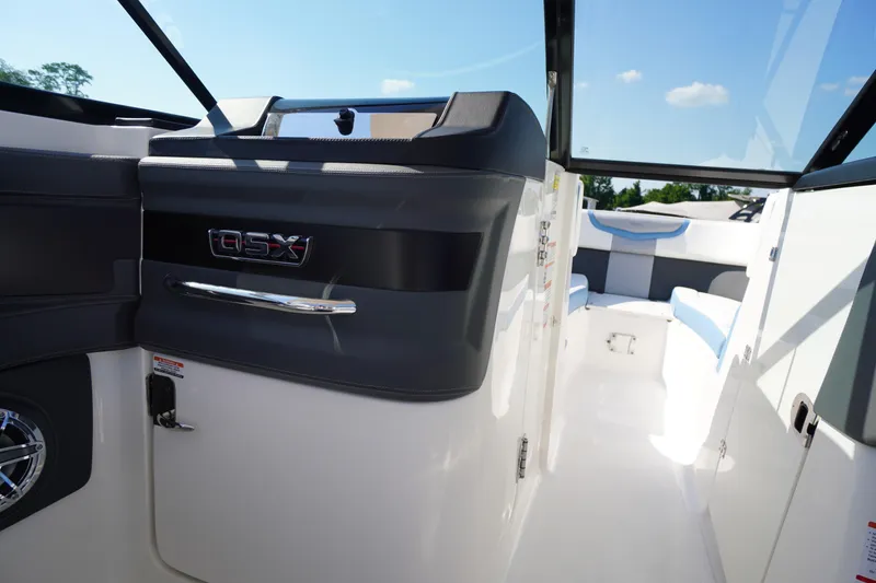 Slide: The Image of Interior view of 2026 Chaparral 270 OSX boat, featuring sleek design and modern seating. - 28