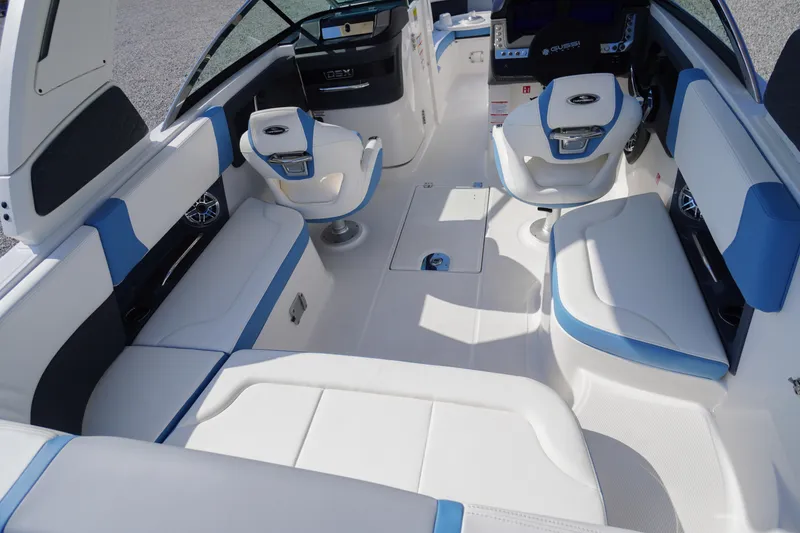 Slide: The Image of 2026 Chaparral 270 OSX boat interior with white and blue seating, modern design. - 42