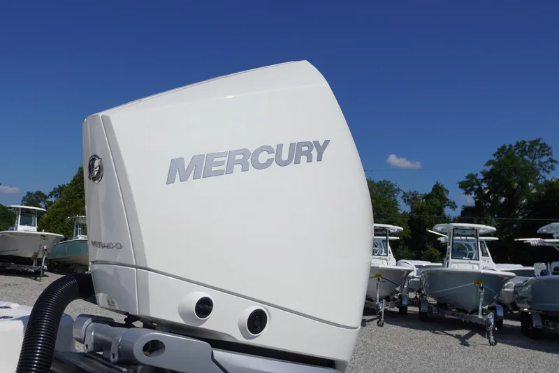 Slide: The Image of Mercury outboard engine on 2026 Chaparral 270 OSX boat, with clear blue sky background. - 73