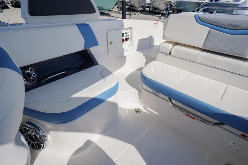 Slide: The Image of Interior seating of 2026 Chaparral 270 OSX boat with blue and white upholstery. - 40
