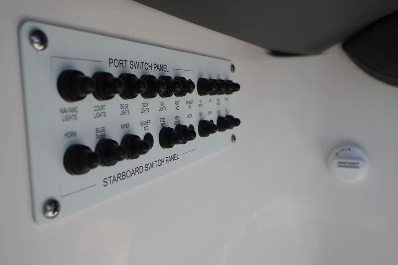 Slide: The Image of Switch panel on 2026 Chaparral 270 OSX boat, featuring various control toggles. - 51