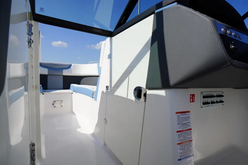 Slide: The Image of Interior view of 2026 Chaparral 270 OSX boat, featuring sleek seating and modern design. - 27