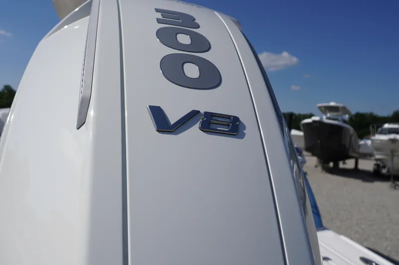 Slide: The Image of Chaparral 270 OSX 2026 boat engine with 300 V8 emblem under clear blue sky. - 74