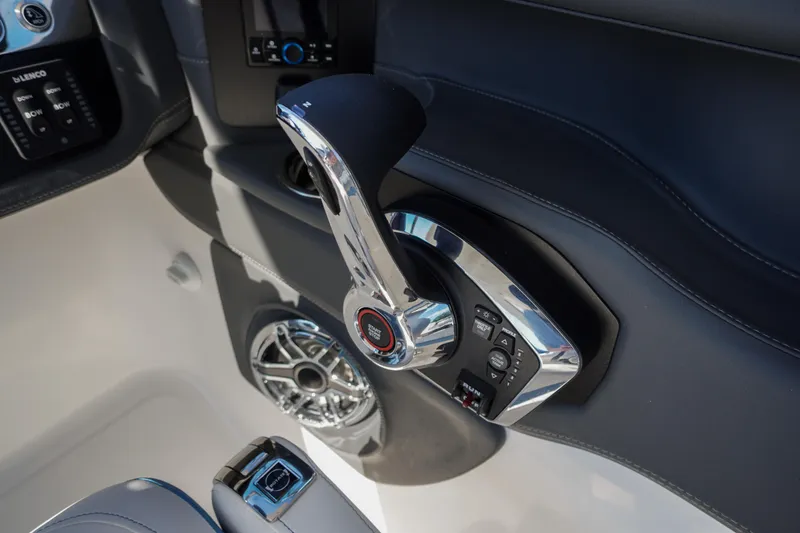 Slide: The Image of Control panel of 2026 Chaparral 270 OSX boat with sleek chrome throttle. - 63
