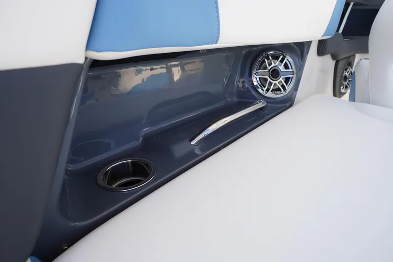 Slide: The Image of 2026 Chaparral 270 OSX boat interior with cup holder and speaker detail. - 44