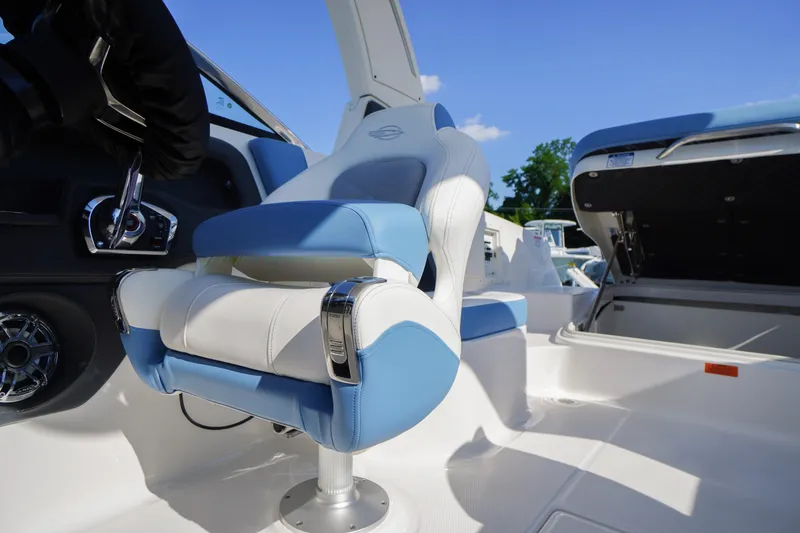 Slide: The Image of 2026 Chaparral 270 OSX boat interior with blue and white seating, showcasing luxury design. - 47