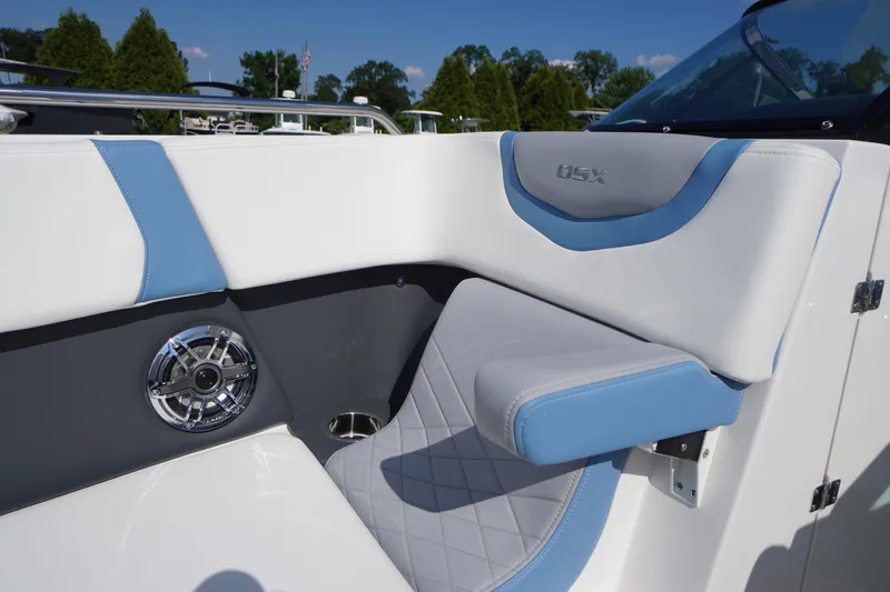 Slide: The Image of Interior seating of 2026 Chaparral 270 OSX boat with blue and white upholstery. - 19