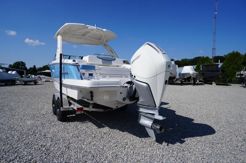 Slide: The Image of 2026 Chaparral 270 OSX boat with Mercury outboard engine on gravel lot. - 71