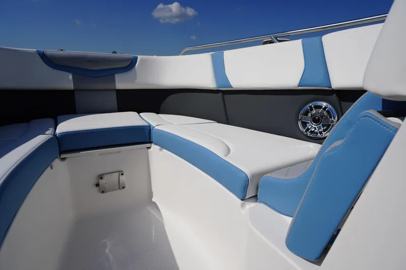 Slide: The Image of Interior seating of 2026 Chaparral 270 OSX boat with blue and white upholstery. - 11