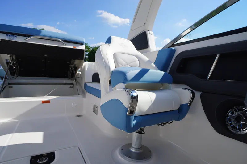 Slide: The Image of Luxury seating on 2026 Chaparral 270 OSX boat, featuring blue and white upholstery. - 48