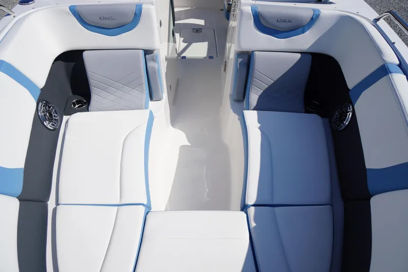 Slide: The Image of 2026 Chaparral 270 OSX boat interior with stylish blue and white seating. - 6