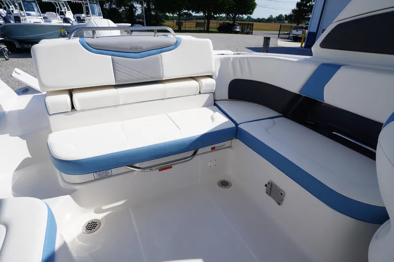 Slide: The Image of 2026 Chaparral 270 OSX boat interior with white and blue seating arrangement. - 38
