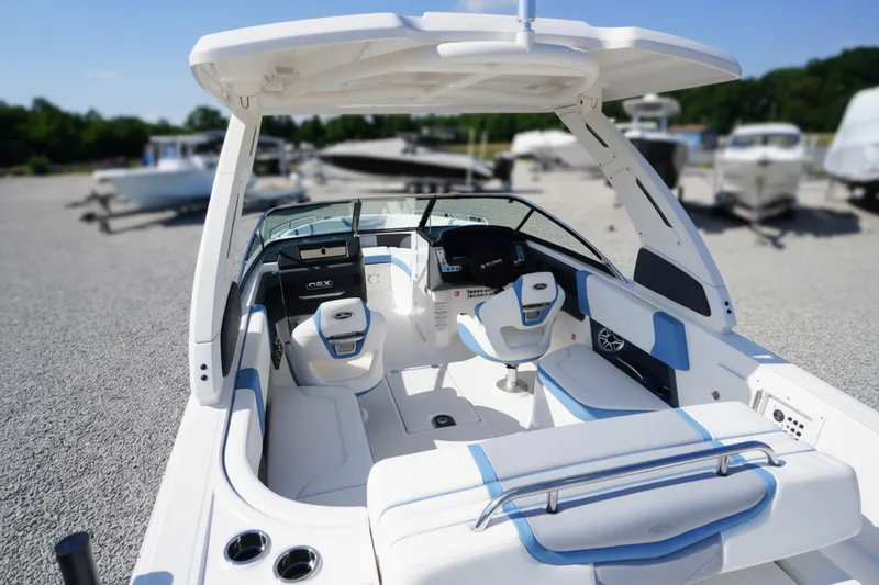 Slide: The Image of 2026 Chaparral 270 OSX boat interior with modern seating and sleek design. - 4