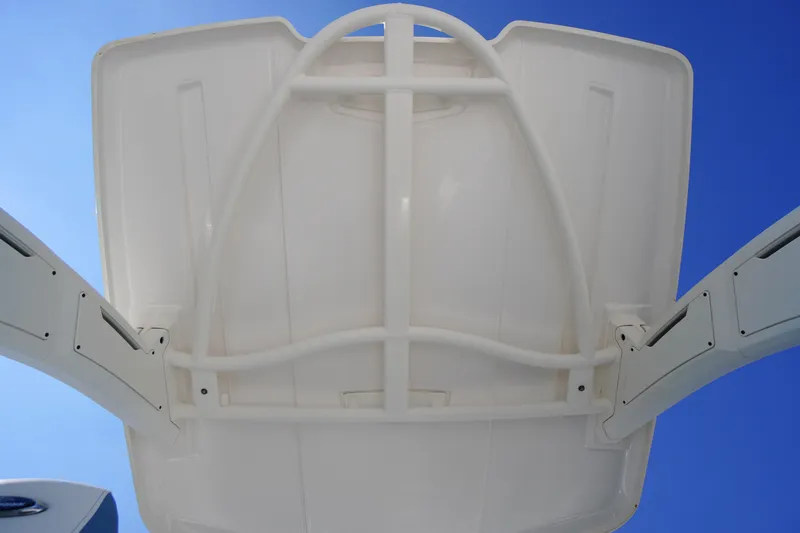 Slide: The Image of 2026 Chaparral 270 OSX boat canopy against clear blue sky. - 69