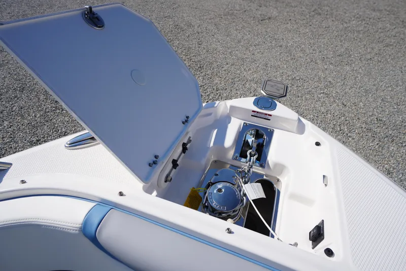 Slide: The Image of Open anchor compartment on 2026 Chaparral 270 OSX boat, showcasing modern design and functionality. - 21
