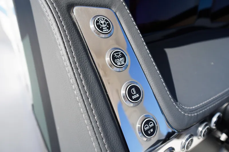 Slide: The Image of Control panel of 2026 Chaparral 270 OSX boat with various function buttons. - 64