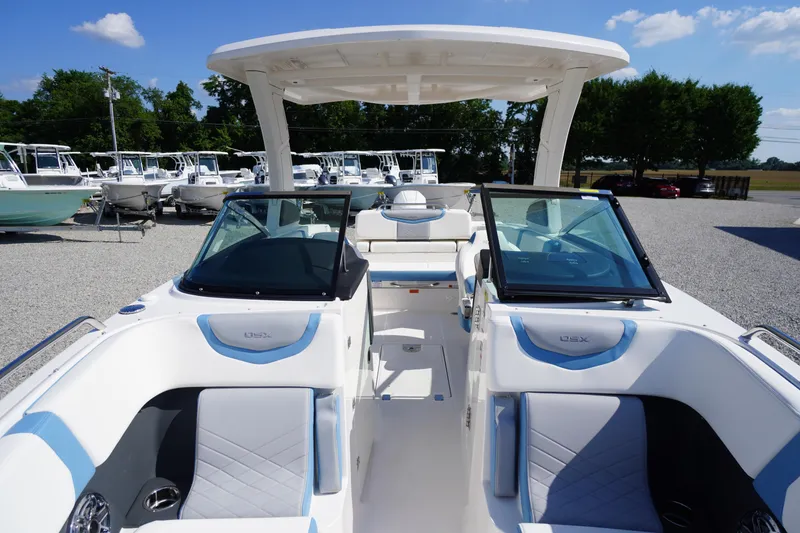 Slide: The Image of 2026 Chaparral 270 OSX boat interior with sleek seating and modern design. - 7