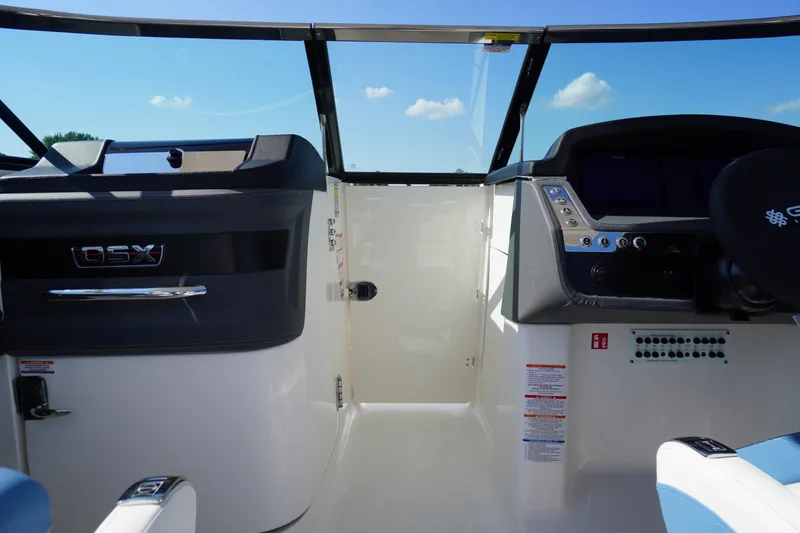 Slide: The Image of Interior view of 2026 Chaparral 270 OSX boat cockpit with modern controls and dashboard. - 26