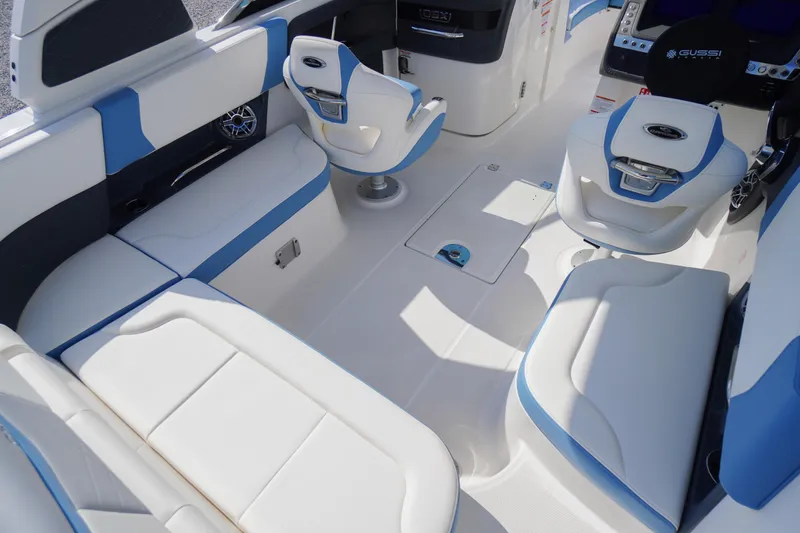 Slide: The Image of Interior of 2026 Chaparral 270 OSX boat with white and blue seating. - 41