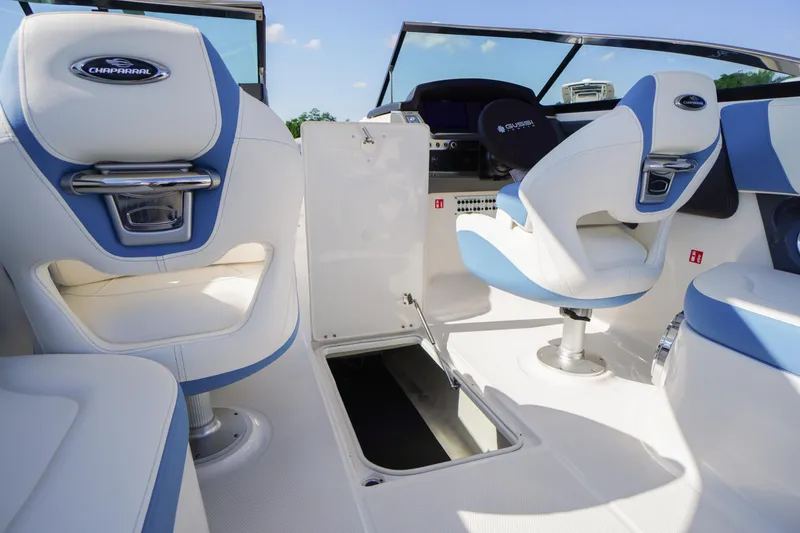 Slide: The Image of Interior of 2026 Chaparral 270 OSX boat with white and blue seating. - 23
