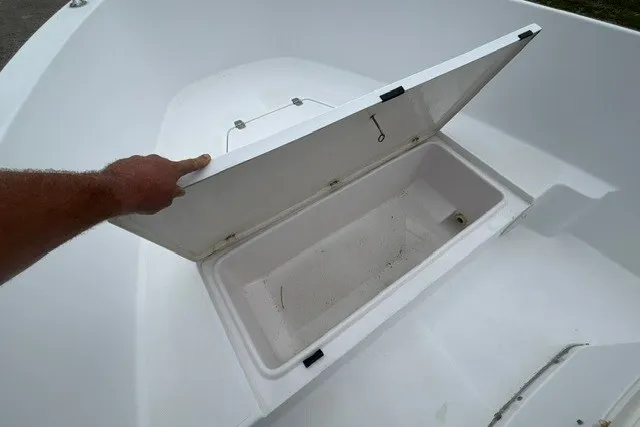 Slide: The Image of Open storage compartment on a 1999 Donzi boat, showcasing interior space. - 19