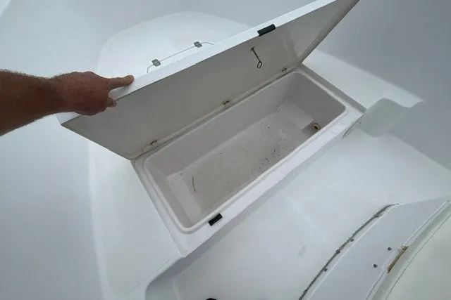 Slide: The Image of Open storage compartment on a 1999 Donzi boat, showcasing interior space. - 18