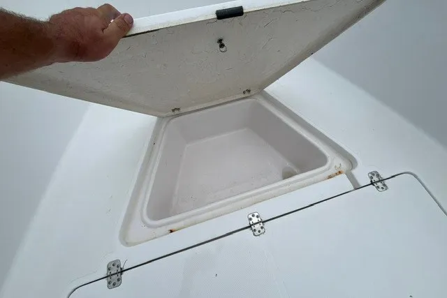 Slide: The Image of Open storage compartment on a 1999 Donzi boat, showcasing interior space. - 20