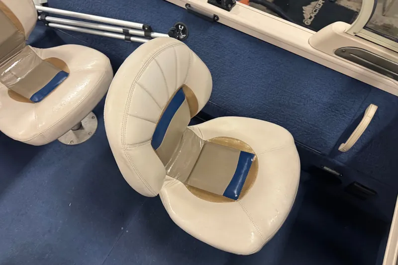 Slide: The Image of 2001 Crestliner 1700 boat interior with blue and beige seating. - 10