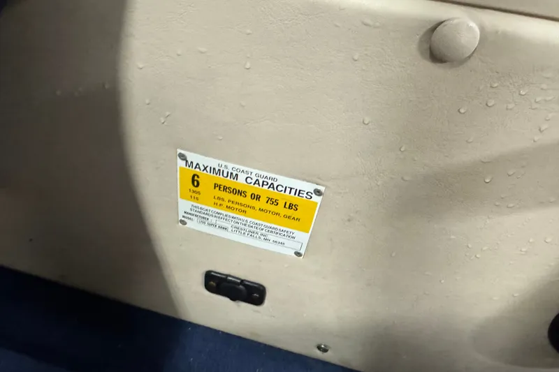 Slide: The Image of 2001 Crestliner 1700 boat capacity label, indicating a maximum of 6 persons or 755 lbs. - 8