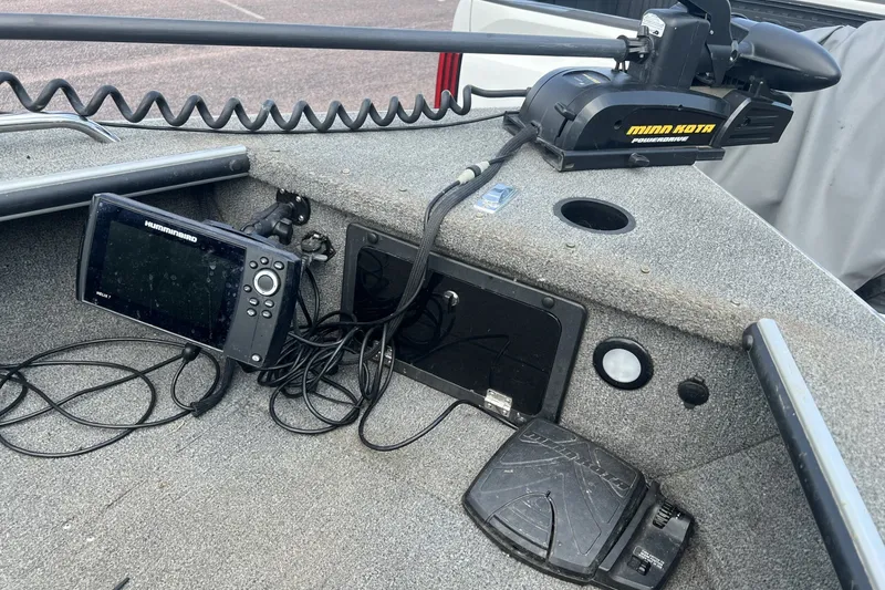 Slide: The Image of 2012 Alumacraft Trophy 175 boat dashboard with Humminbird electronics and Minn Kota trolling motor. - 6