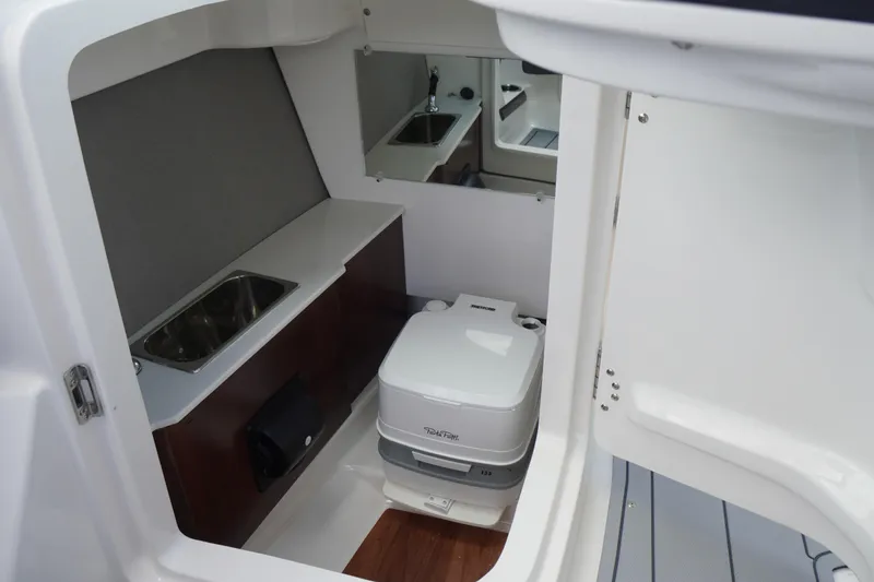 Slide: The Image of 2026 Chaparral SSX 4 boat interior with sink and portable toilet. - 42