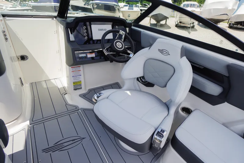 Slide: The Image of 2026 Chaparral SSX 4 boat interior with modern dashboard and luxurious seating. - 29
