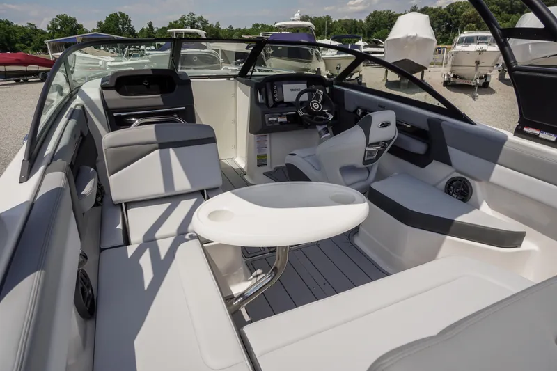 Slide: The Image of 2026 Chaparral SSX 4 boat interior with modern seating and steering console. - 47