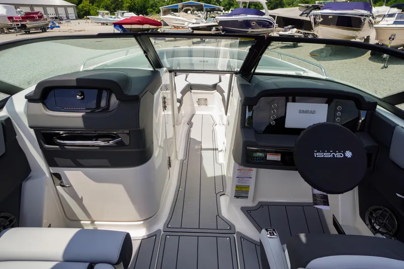 Slide: The Image of 2026 Chaparral SSX 4 boat interior with modern dashboard and seating. - 22