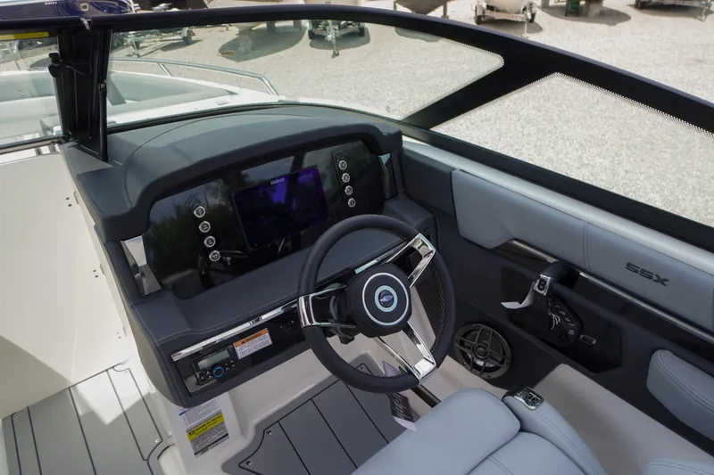 Slide: The Image of 2026 Chaparral SSX 4 boat cockpit with modern steering and dashboard controls. - 24