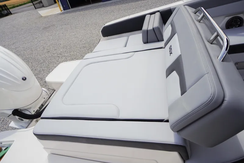 Slide: The Image of 2026 Chaparral SSX 4 boat interior with sleek gray seating and modern design. - 57