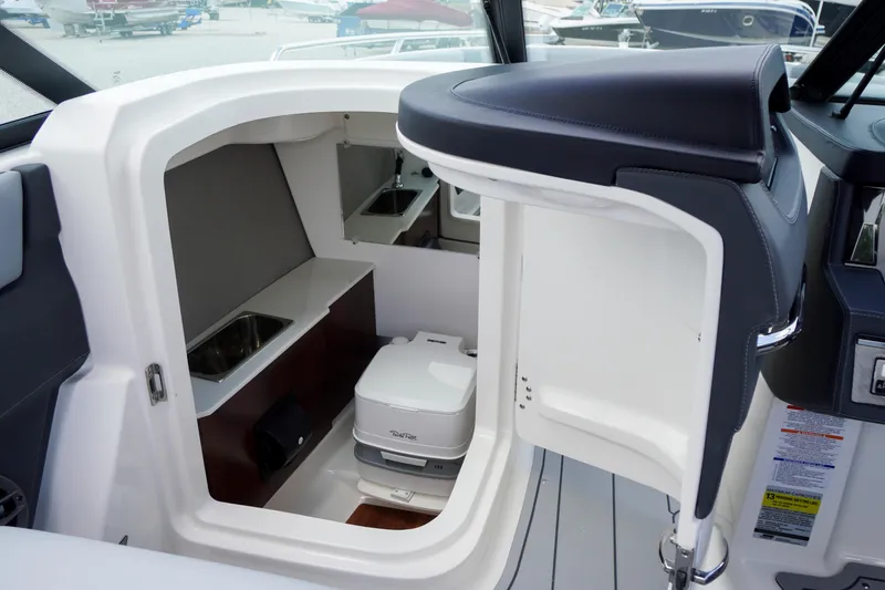 Slide: The Image of 2026 Chaparral SSX 4 boat interior with compact cabin and modern amenities. - 41