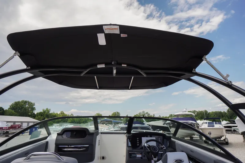 Slide: The Image of 2026 Chaparral SSX 4 boat interior with canopy and steering console. - 66